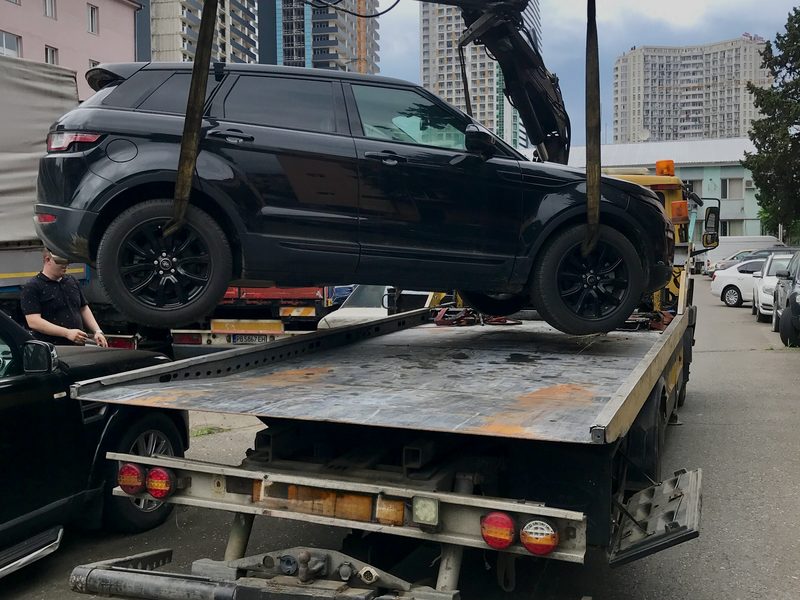 Range Rover Evoque lifted onto a recovery transporter in Tbilisi, Georgia